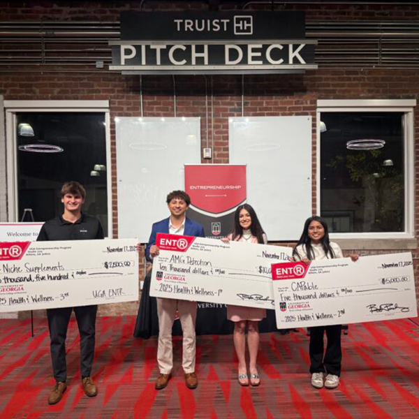 Health and Wellness Pitch Contest winners with giant checkts