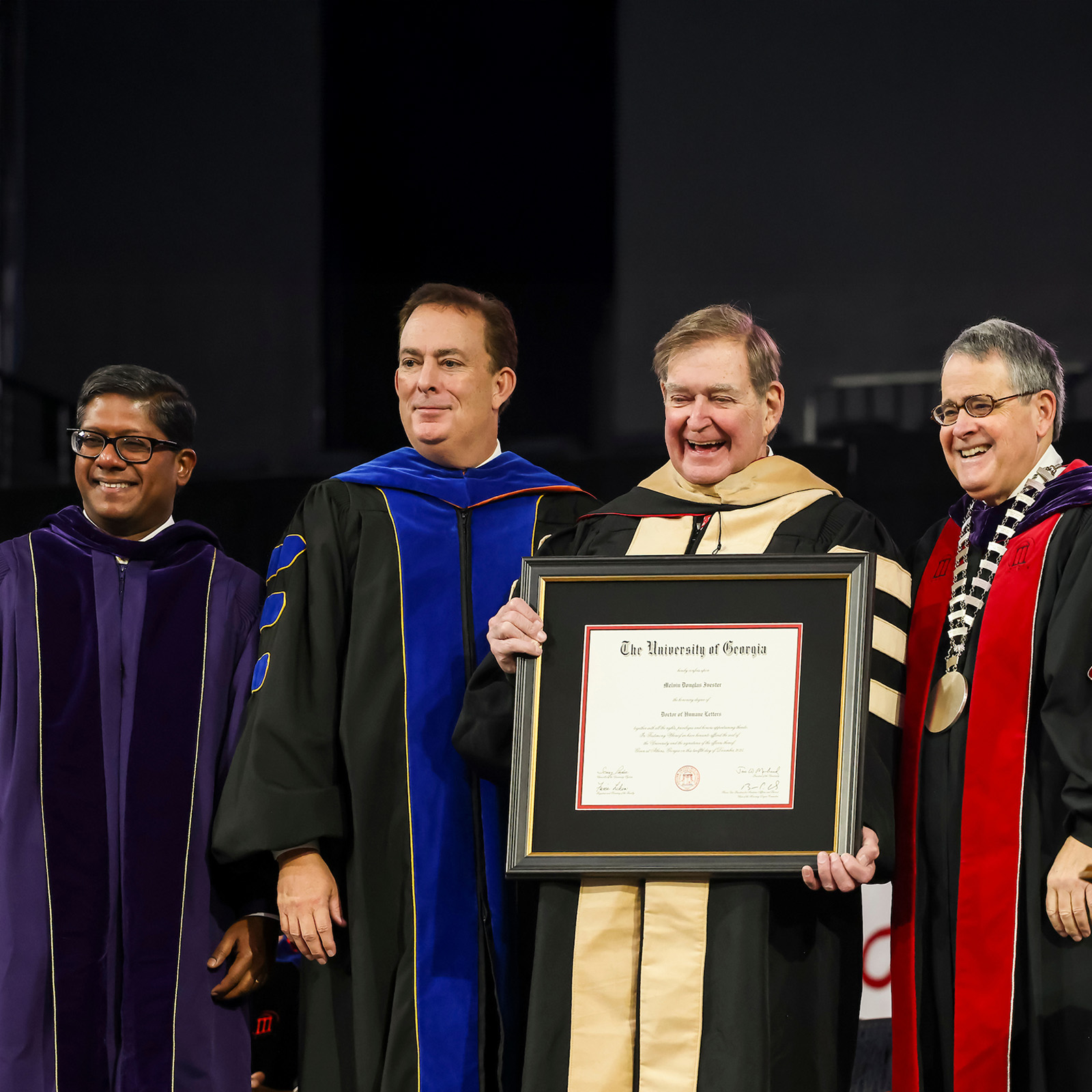 Doug Ivester accepts honorary degree from Jere Morehead, Ben Ayers and Santanu Chatterjee