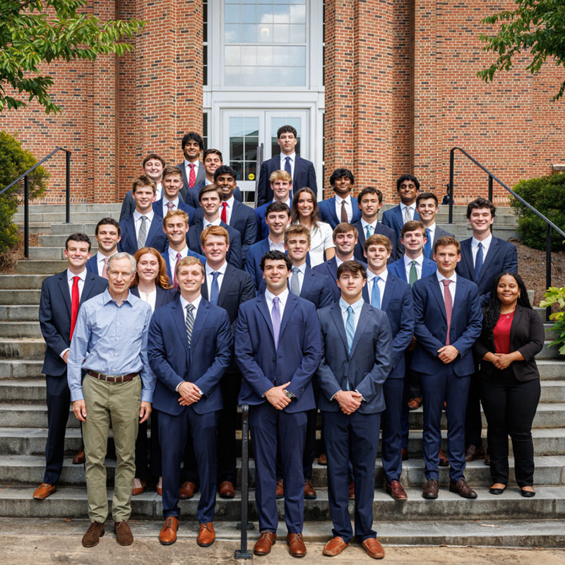 Students in the Student Managed Investment Fund pose on the steps of Correll Hall
