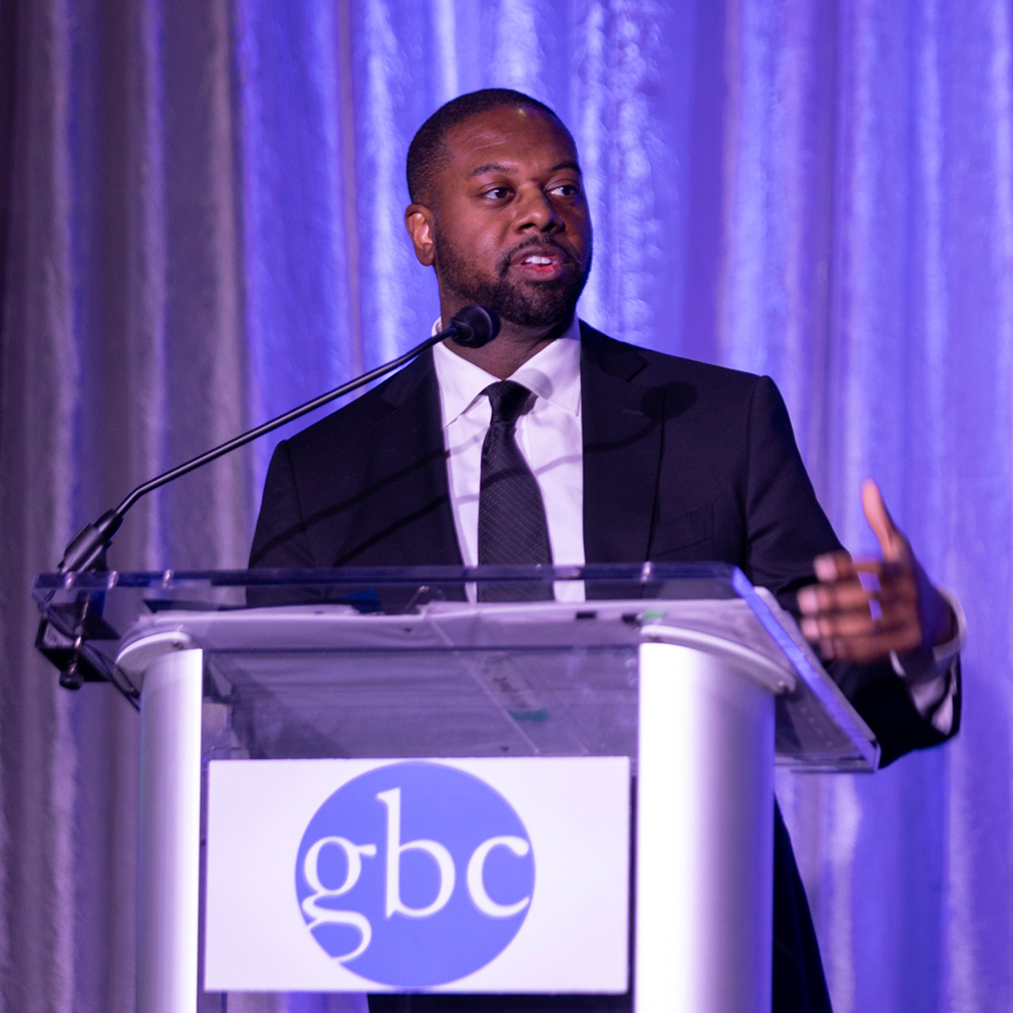 Mark Anthony Thomas speaks a Greater Baltimore Committee lectern.