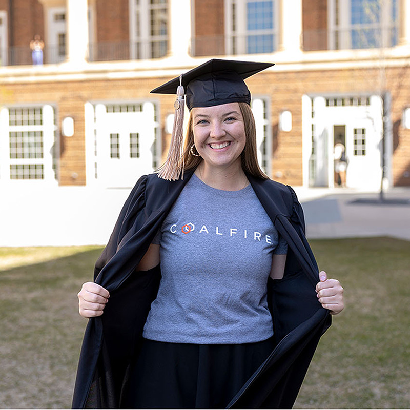 Hannah Brown poses in her grad cap and Coalfire tshirt