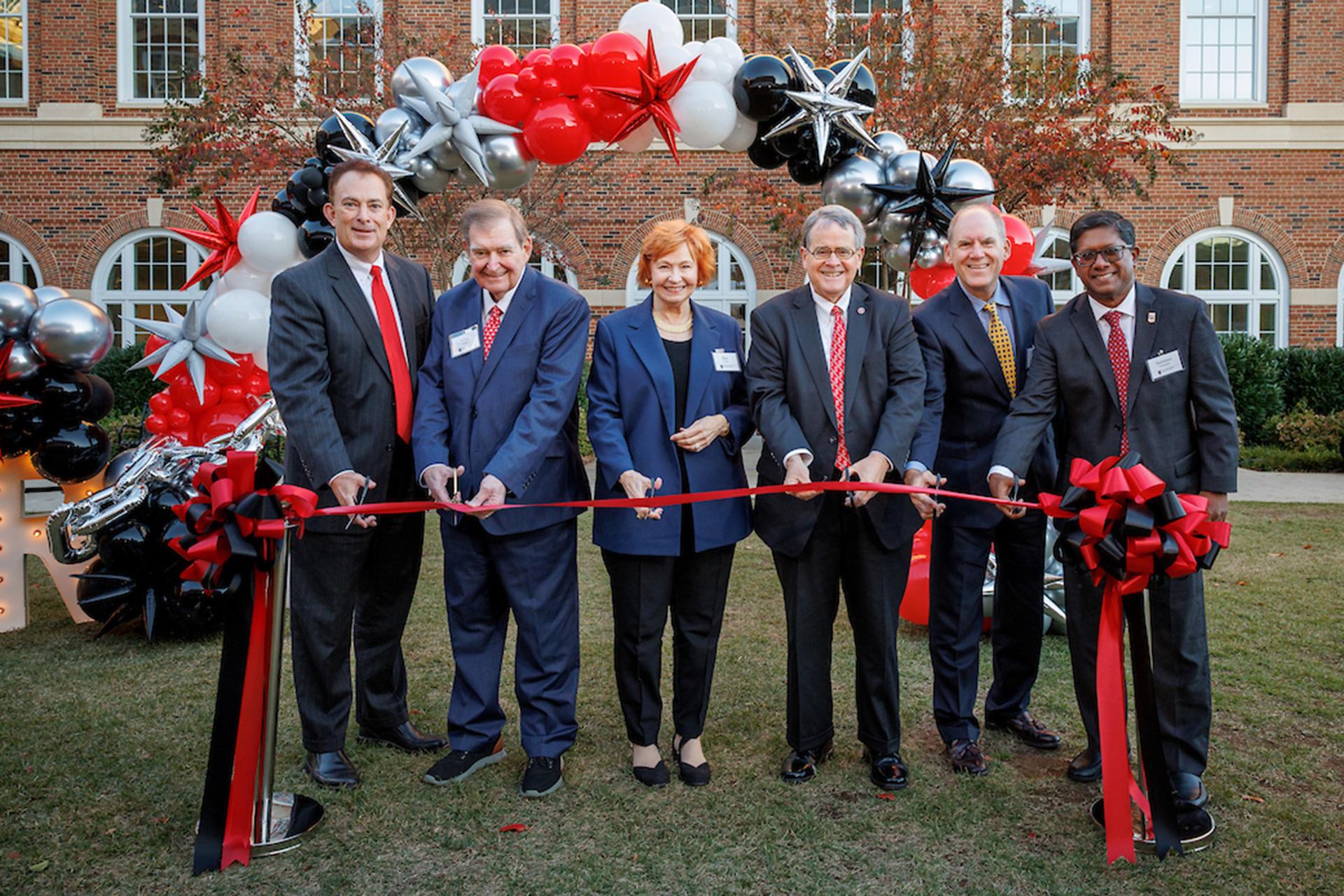 Dignitaries including Kay and Doug Ivester, Dean Ben Ayers, UGA President Jere Morehead, Chris Cornwell and Santanu Chatterjee, cut a ceremonial ribbon in Coca Cola Plaza.d