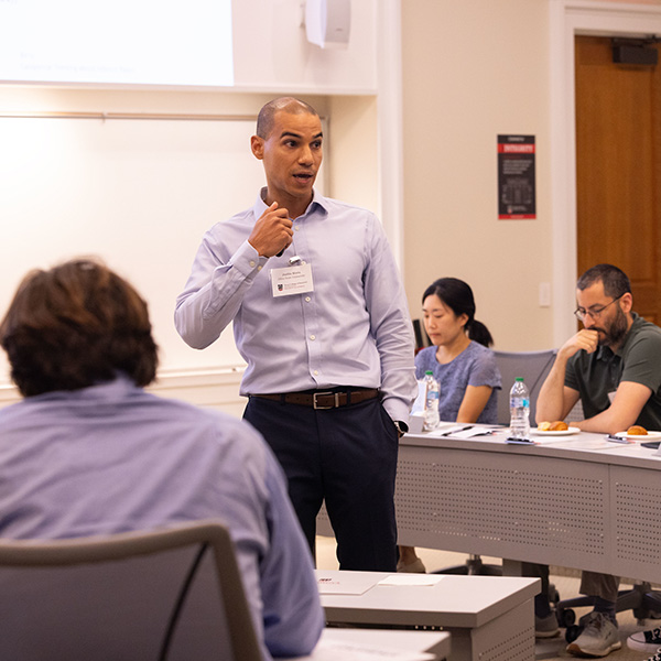 Justin Birru, an associate professor of finance at Ohio State, discusses a paper in front of other finance faculty in Terry College classroom.