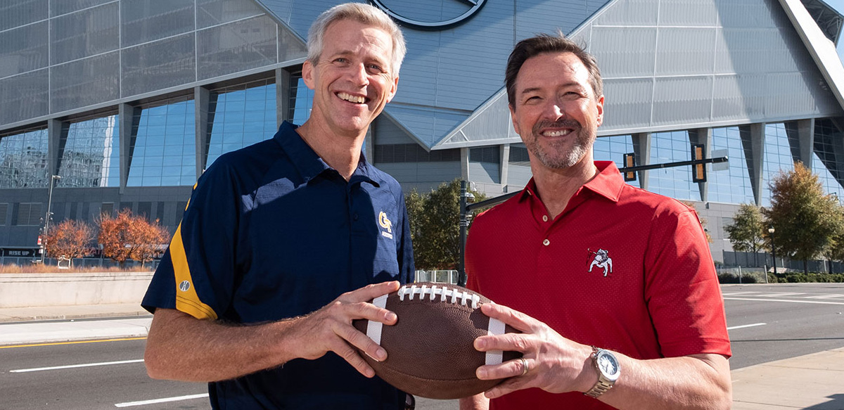 Georgia Tech Executive Vice President for Research Tim Lieuwen and University of Georgia interim Vice President for Research Chris King in front of Mercedes Benz Stadium (UGA Marcomms)