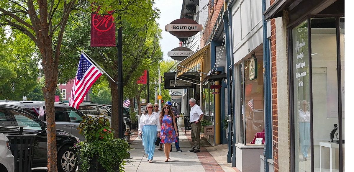 Hartwell community members tour downtown Monroe to see how the city has implemented branding created with the UGA Institute of Government. (Sara Ingram)