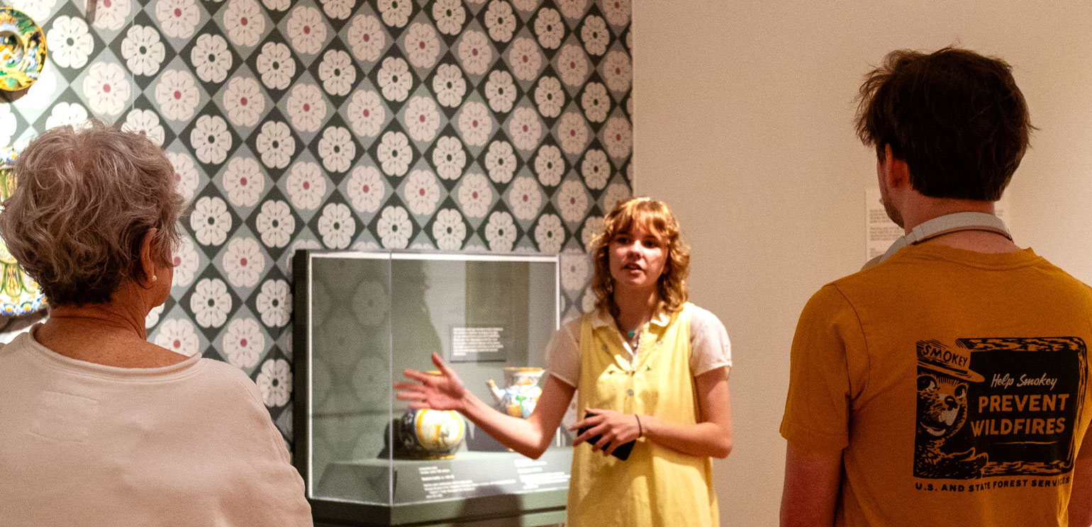 A student guide giving a tour in the museum