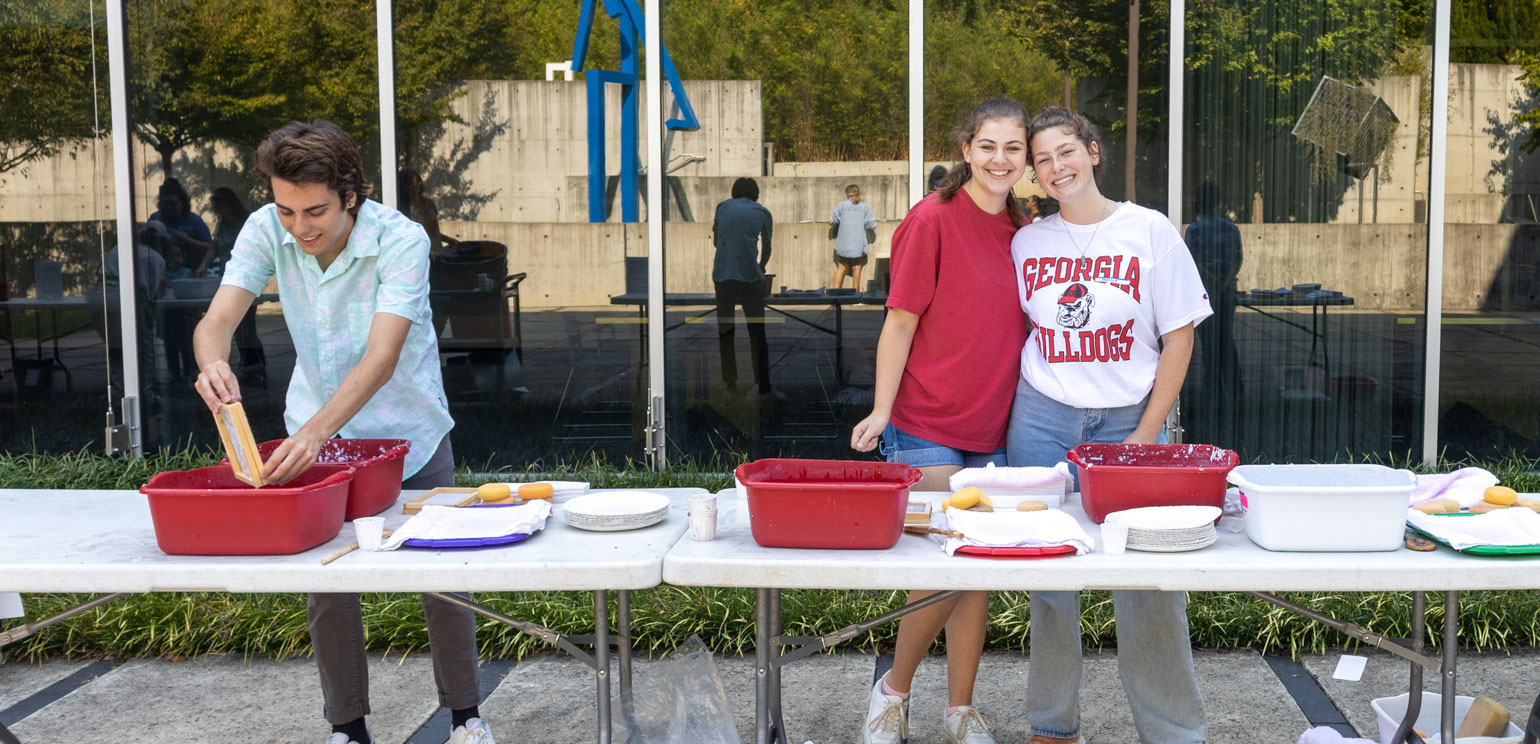 UGA students helping with a program in the museum's sculpture garden