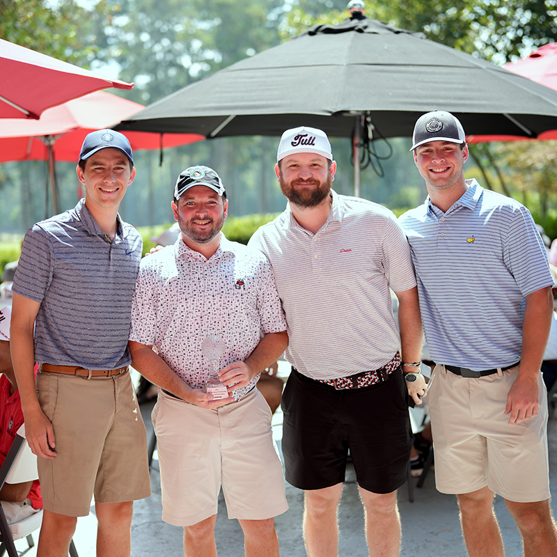 Group photo of 4 male golfers