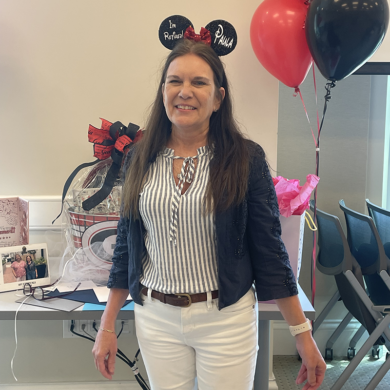 Paula Smith smiling for a photo during her retirement celebration