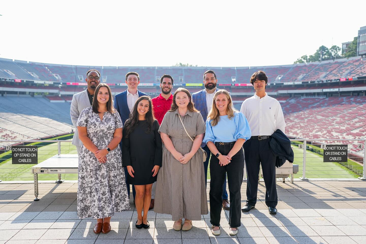 Group photo of Young Alumni Board members at Sanford Stadium