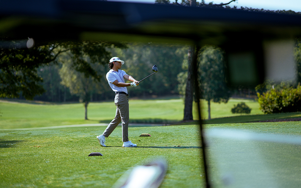Shot of golfer on the follow-through phase of his swing
