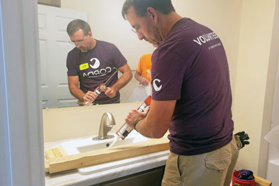 Corda volunteer caulking bathroom sink