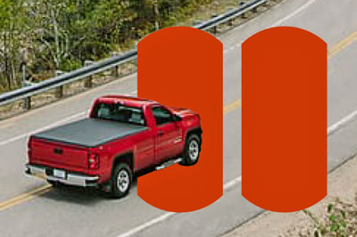 Red truck on the road. Red pause symbol.