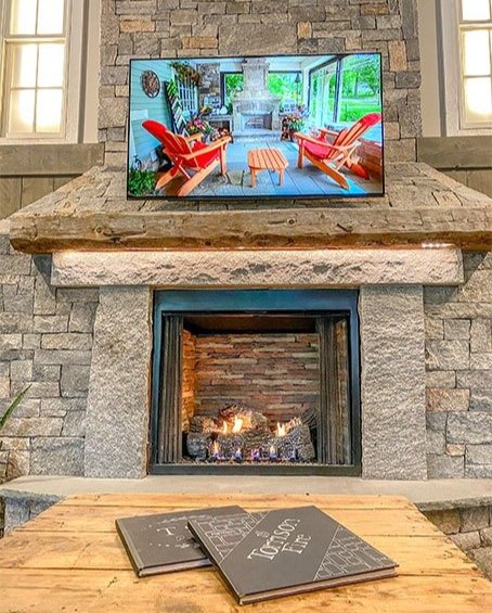 stone veneer fireplace in The Fire Room Showroom at Torrison Stone & Garden