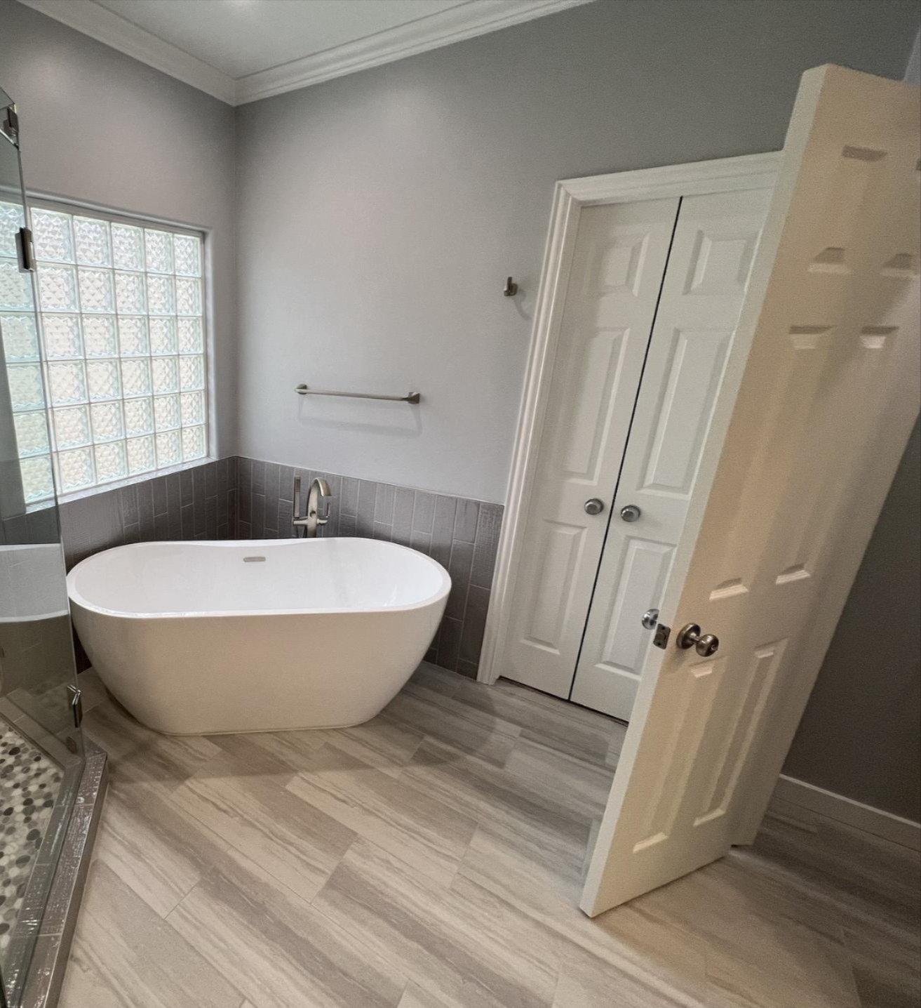 Tile Zone laminate flooring installation in Houston bathroom — elegant, durable, and expertly installed floors for residential remodeling projects