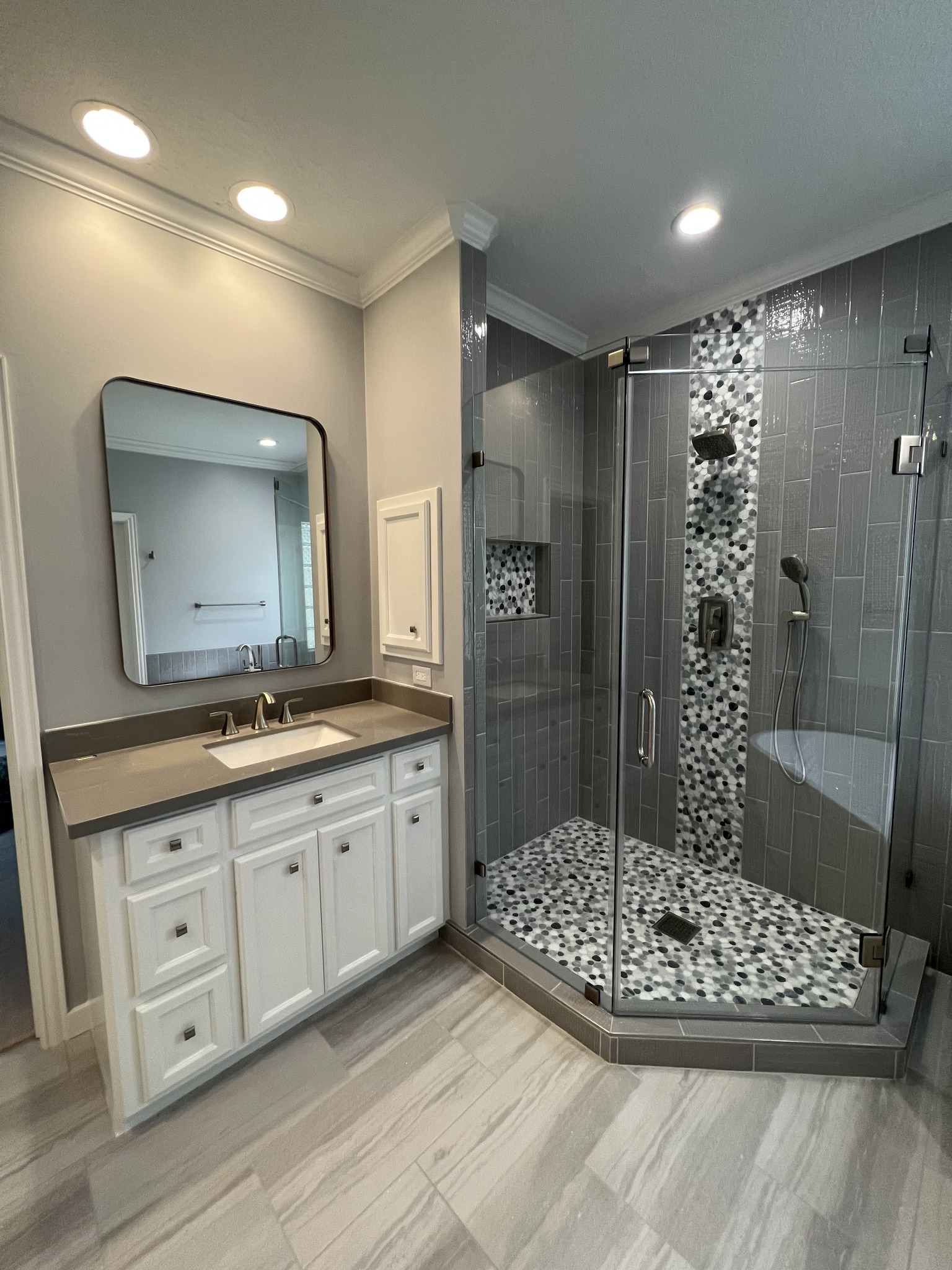 Modern bathroom with laminate flooring by Tile Zone — showcasing Houston’s trusted experts for stylish, long-lasting flooring and remodeling solutions