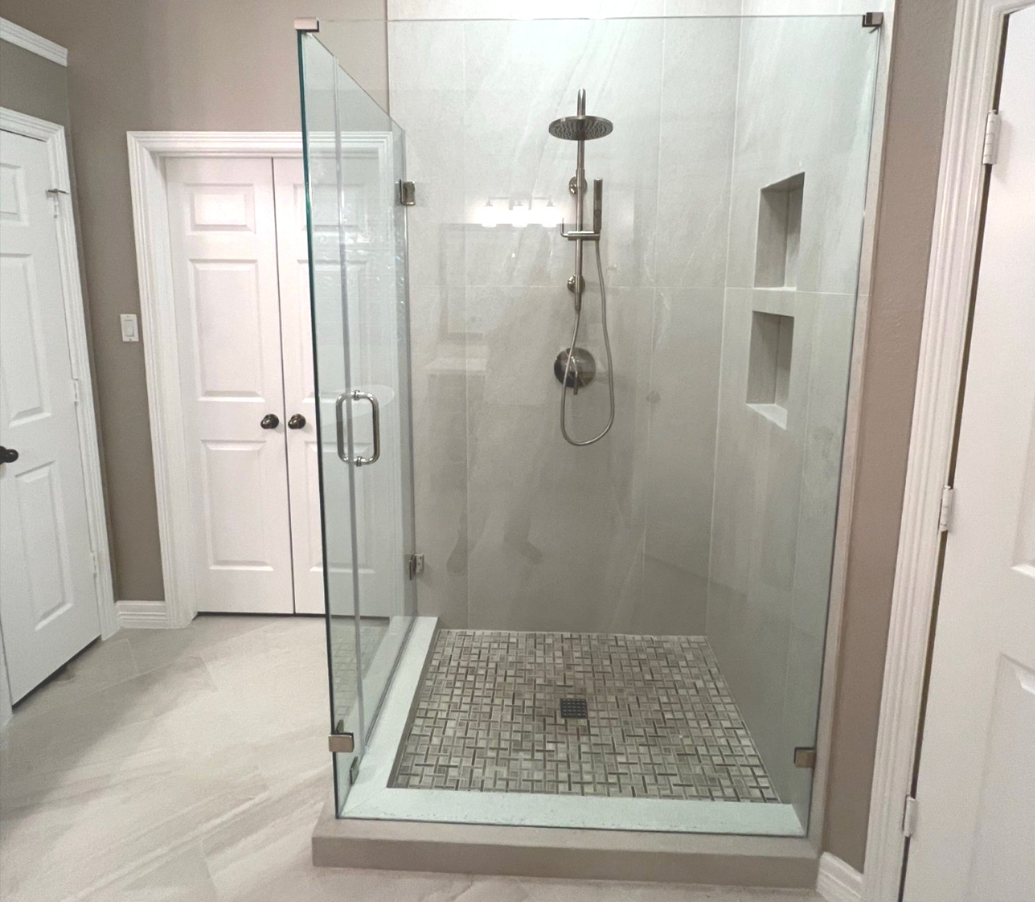 Frameless shower glass installation in Fulshear, TX by Tile Zone — creating modern, open-concept bathrooms with sleek design and professional craftsmanship