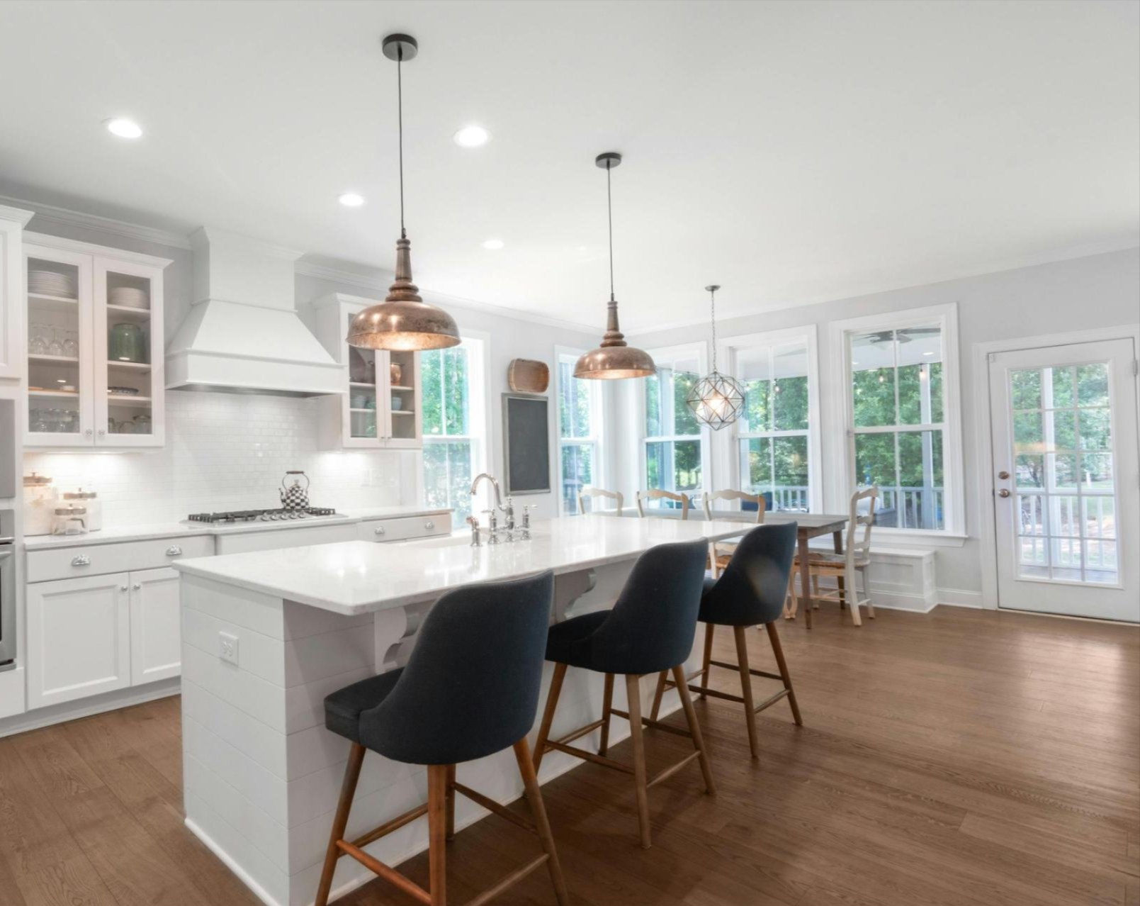 Bright modern kitchen with newly installed hardwood flooring in Houston, TX — Tile Zone showcases elegant wood finishes that enhance home value and design appeal
