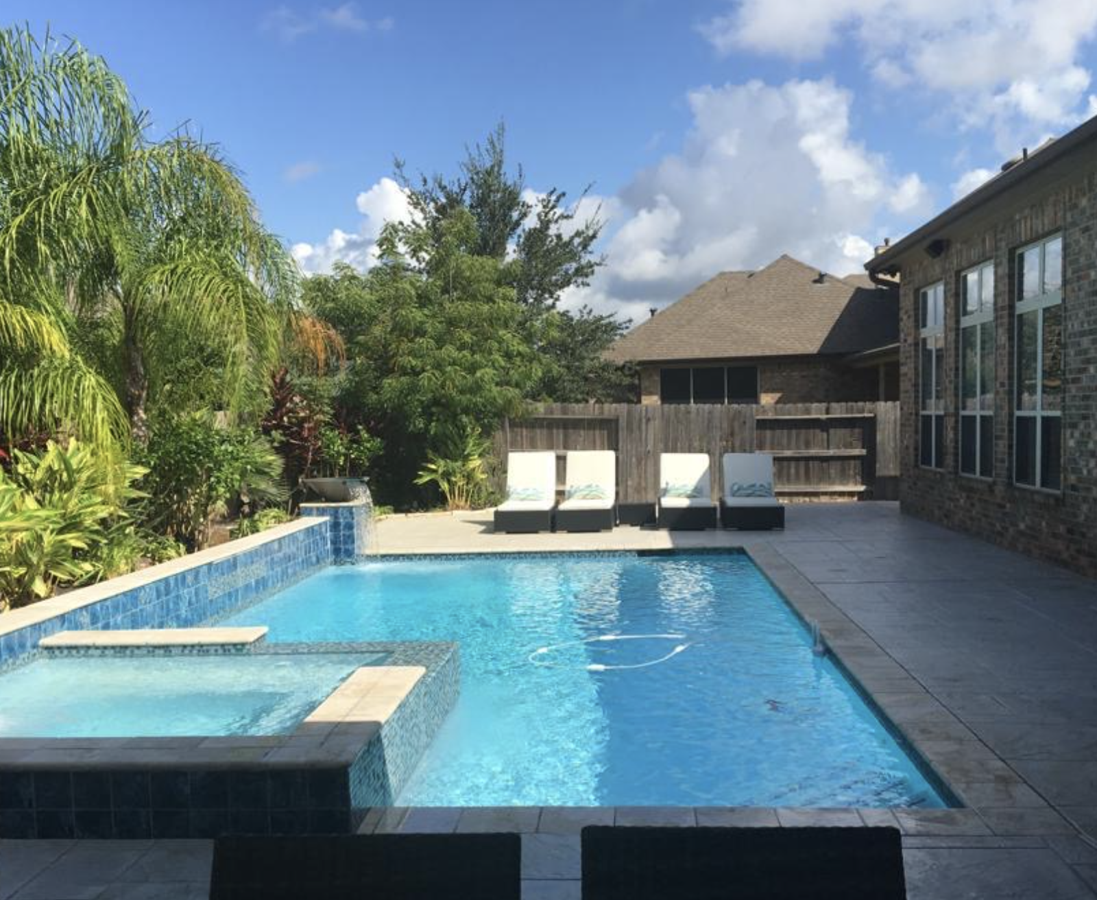 Custom swimming pool design and installation in Houston, TX by Tile Zone — blending outdoor luxury, tile craftsmanship, and modern backyard living