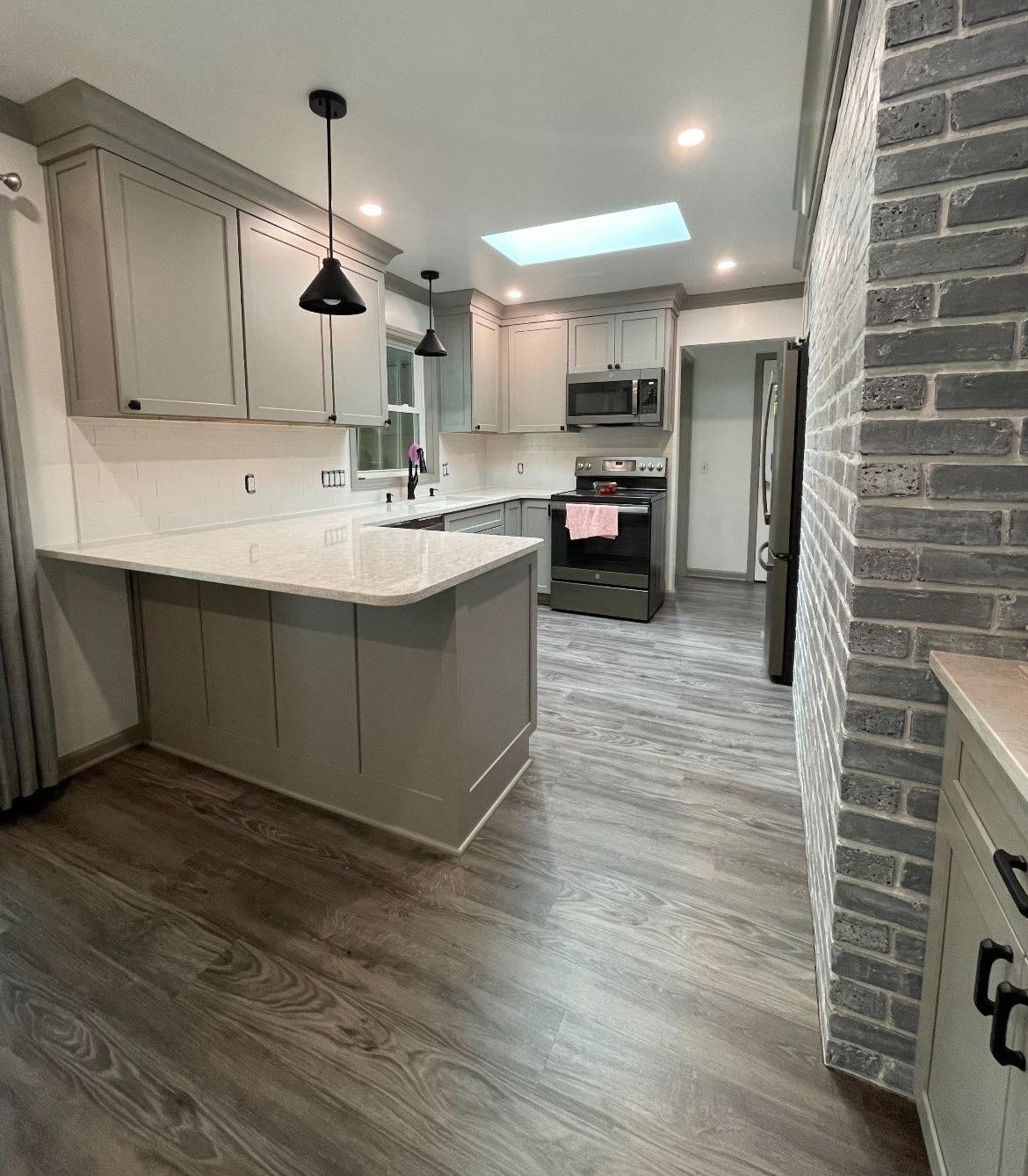 Luxury vinyl flooring installation enhancing a modern Lansing kitchen Luxury vinyl flooring installation enhancing a modern Lansing kitchen