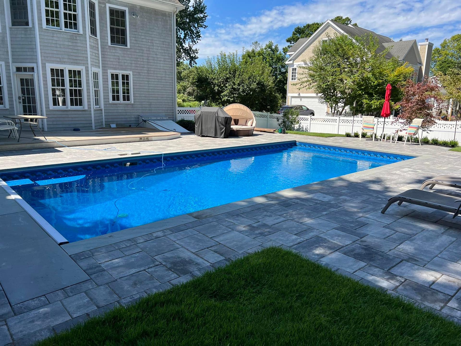 Scheduled pool maintenance keeping water swim-ready for summer