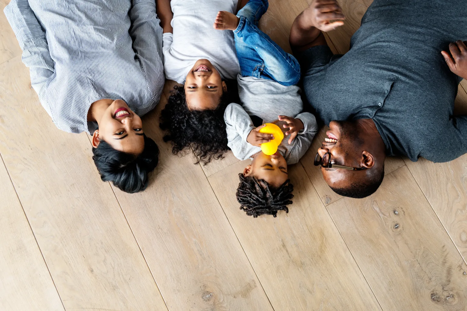 Family laying on Luxury Vinyl Plank Flooring