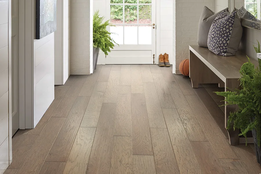 Child playing with dog on stylish vinyl flooring
