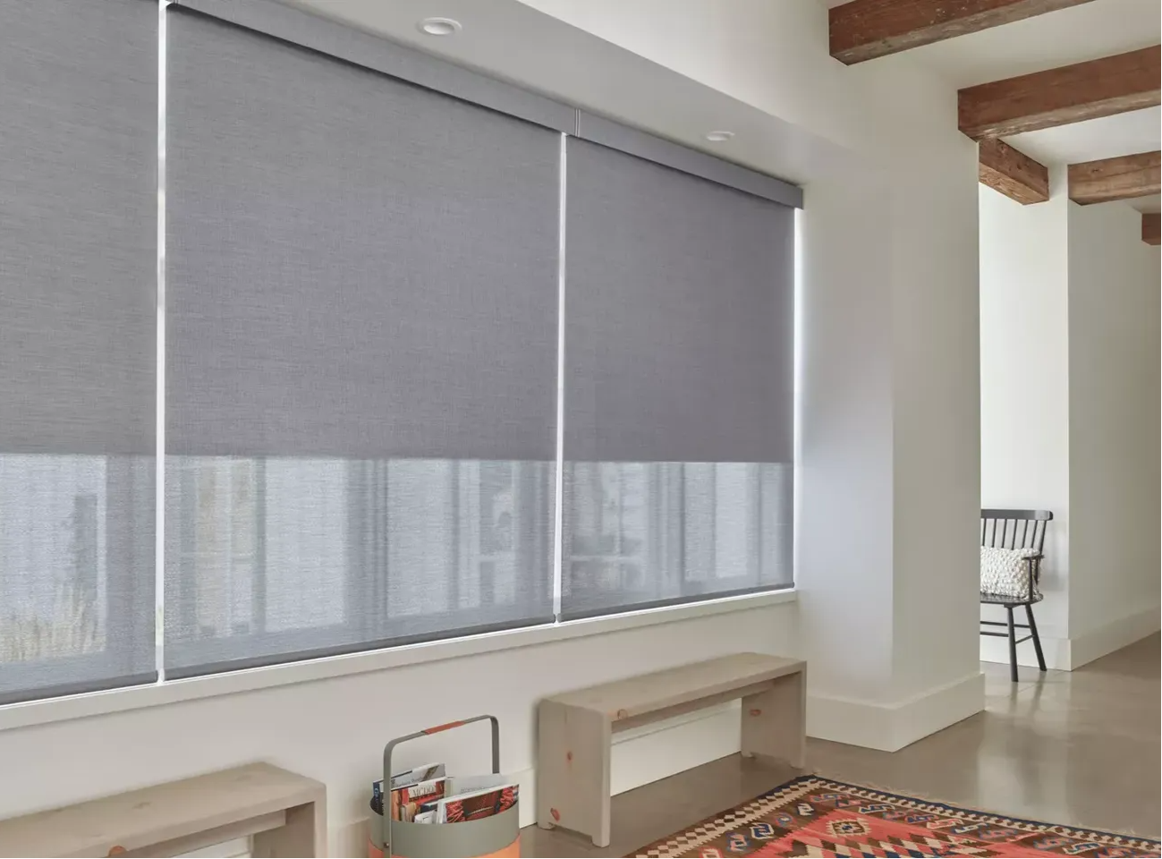 Modern living room with Hunter Douglas vertical blinds professionally installed by Floor & Window Covering Connection