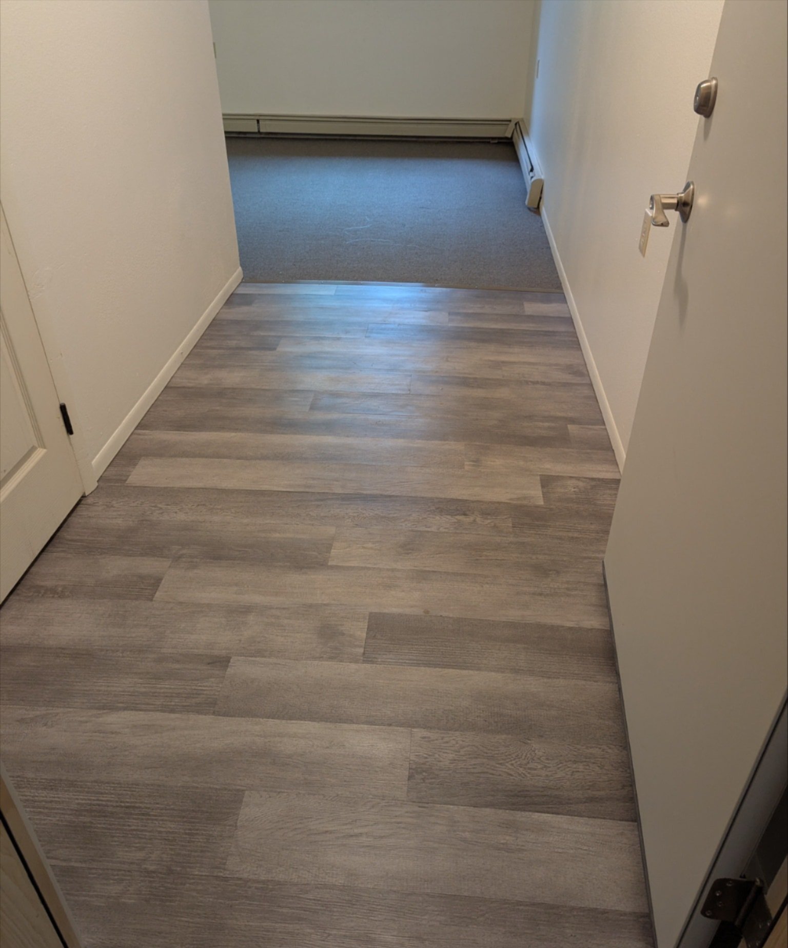 Cañon City home hallway featuring newly installed gray laminate Cañon City home hallway featuring newly installed gray laminate