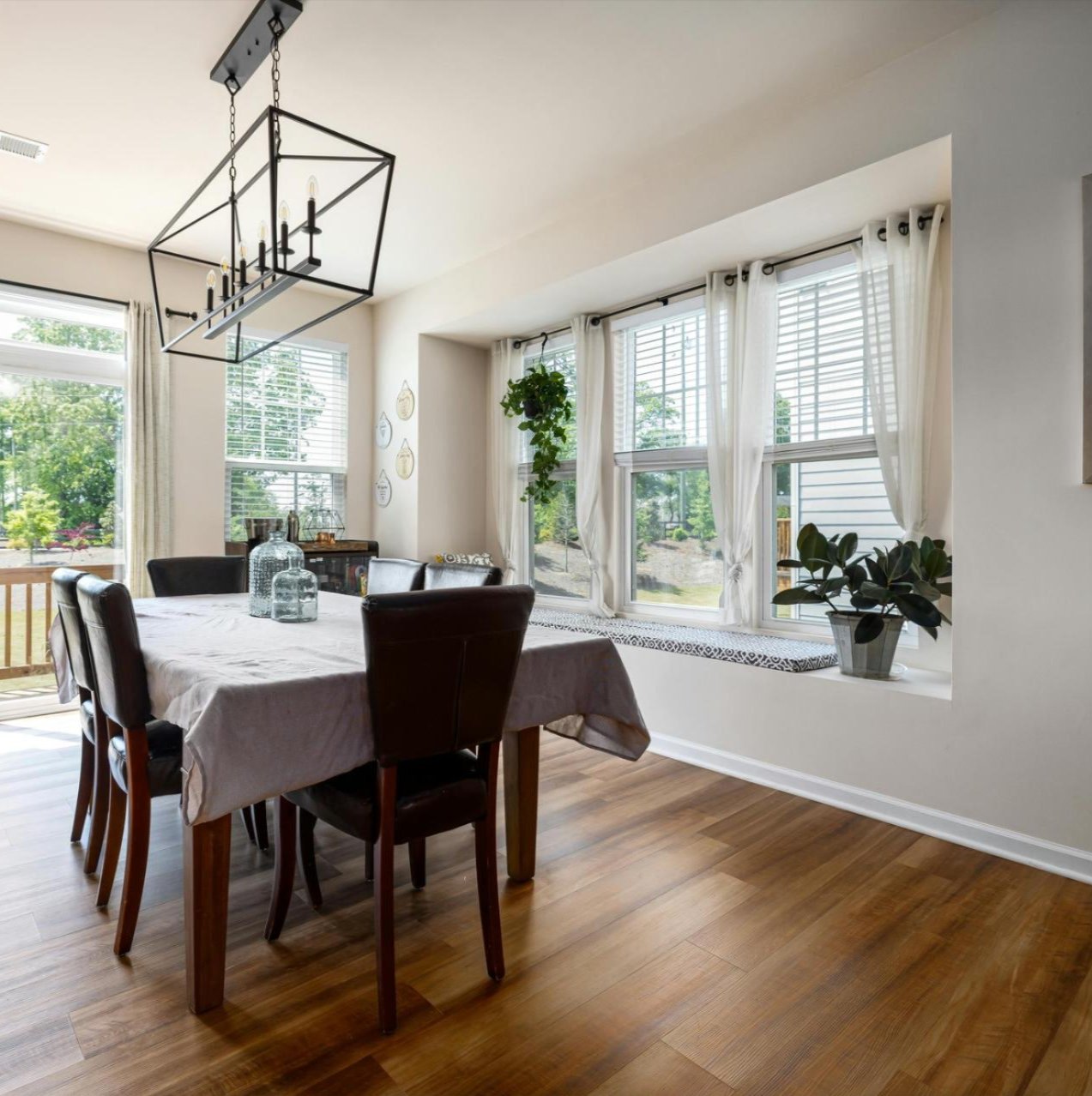 Dining room in Florence, CO home featuring professionally installed wood flooring by Floor & Window Covering Connection