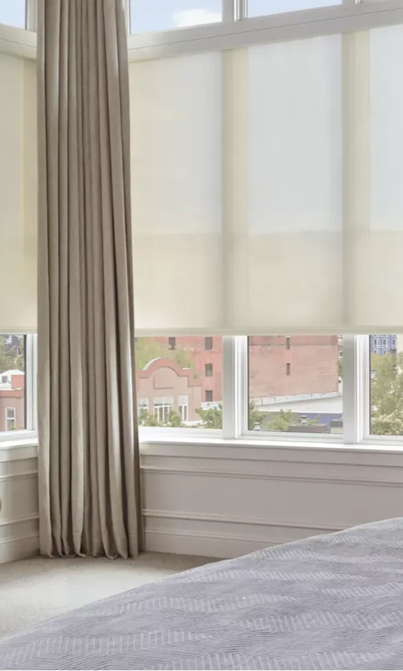 Custom Hunter Douglas window treatments in a contemporary styled bedroom in Colorado