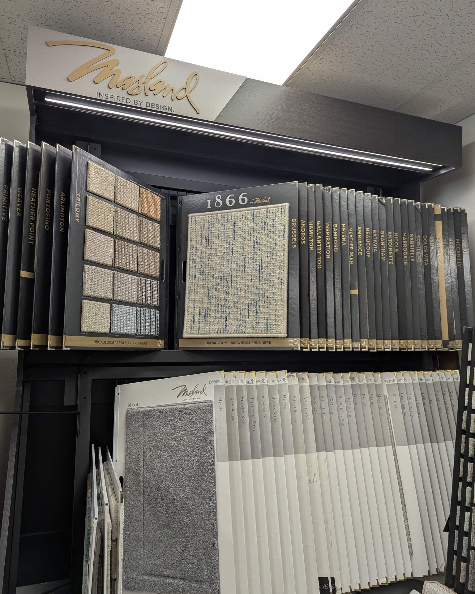 Carpet and rug binding sample display at a Cañon City, CO flooring showroom, featuring materials for custom-bound rugs
