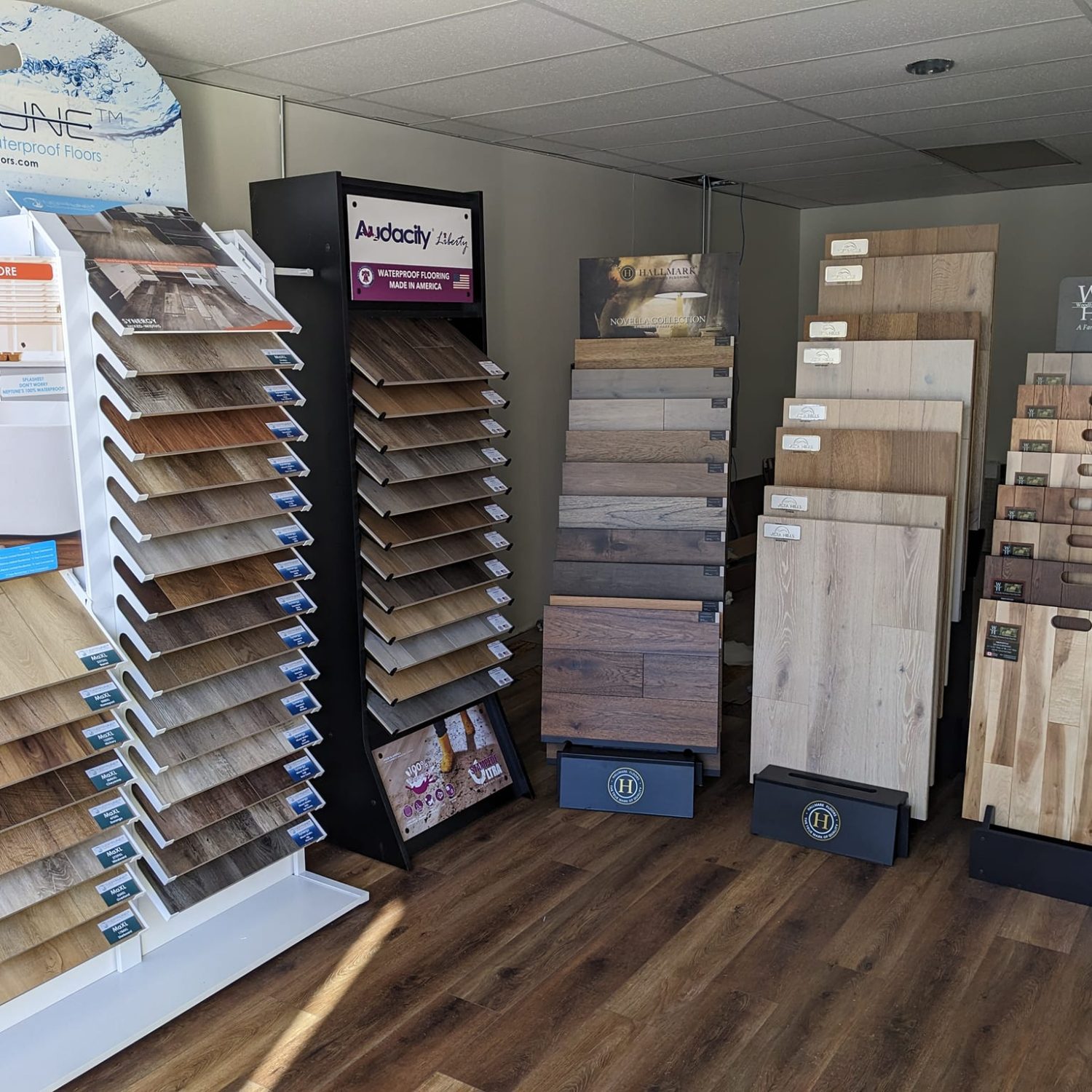 Luxury vinyl and hardwood flooring samples at the Floor & Window Covering Connection showroom — explore quality flooring selections