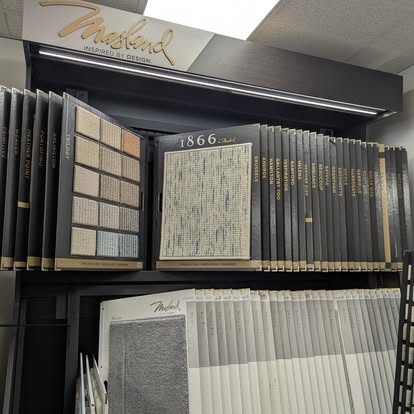 Carpet sample display at a Cañon City, CO flooring showroom offering a variety of carpet styles and textures