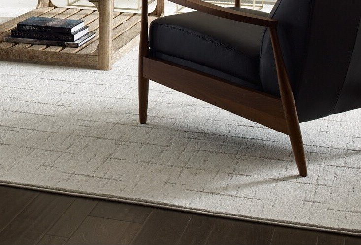 Custom-bound area rug in a Cañon City, CO home created from carpet remnants