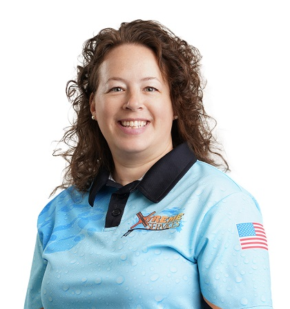 Portrait of Julie Hatch in Xtreme Services company uniform