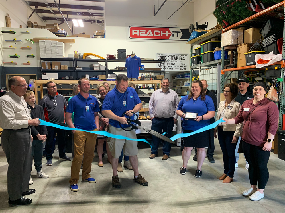Xtreme Services team at ribbon cutting ceremony for opening of company office