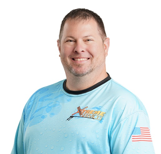Portrait of Jason Hatch in Xtreme Services company uniform