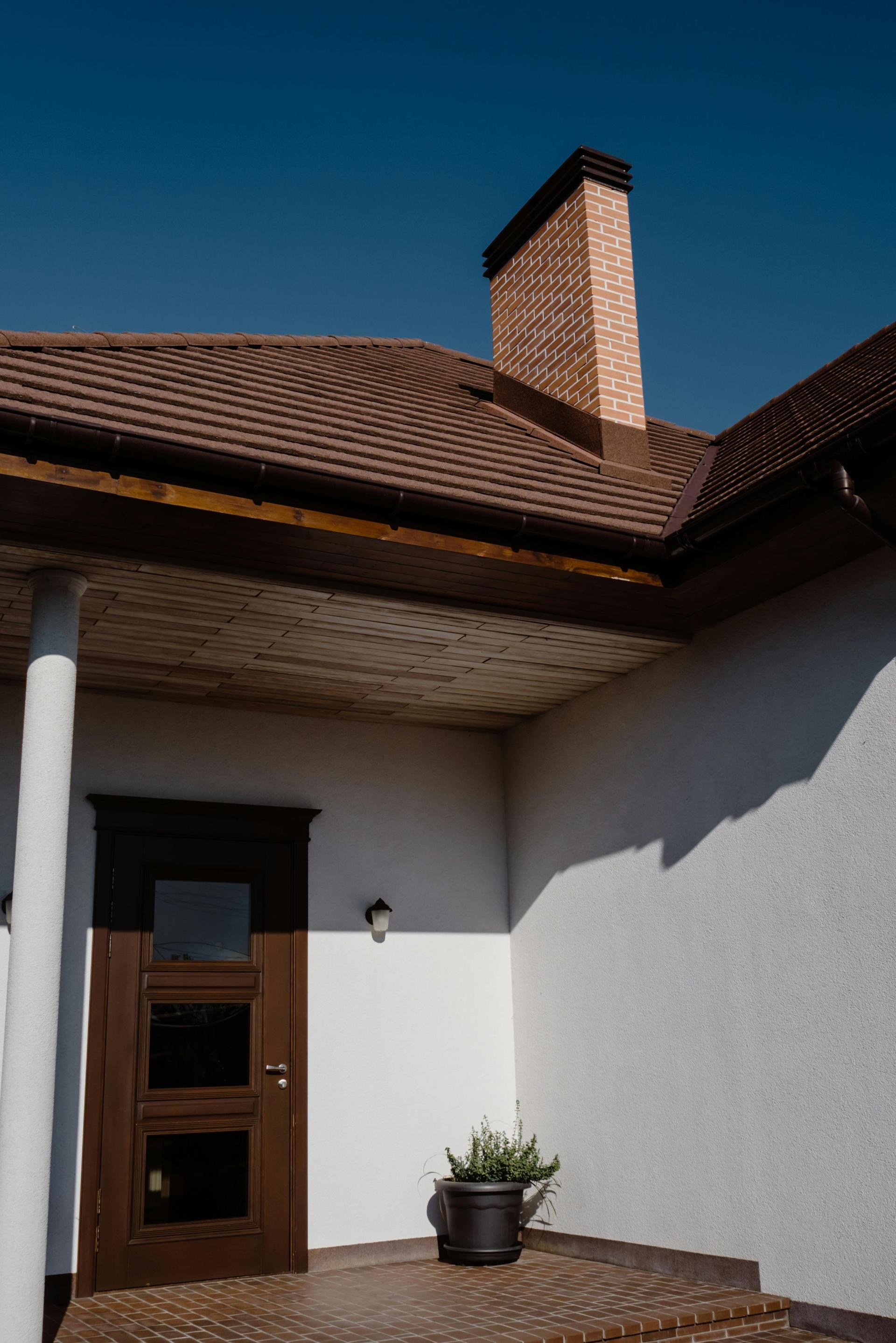Showing a home with walls power washed and pristine roof from the Xtreme Services portfolio