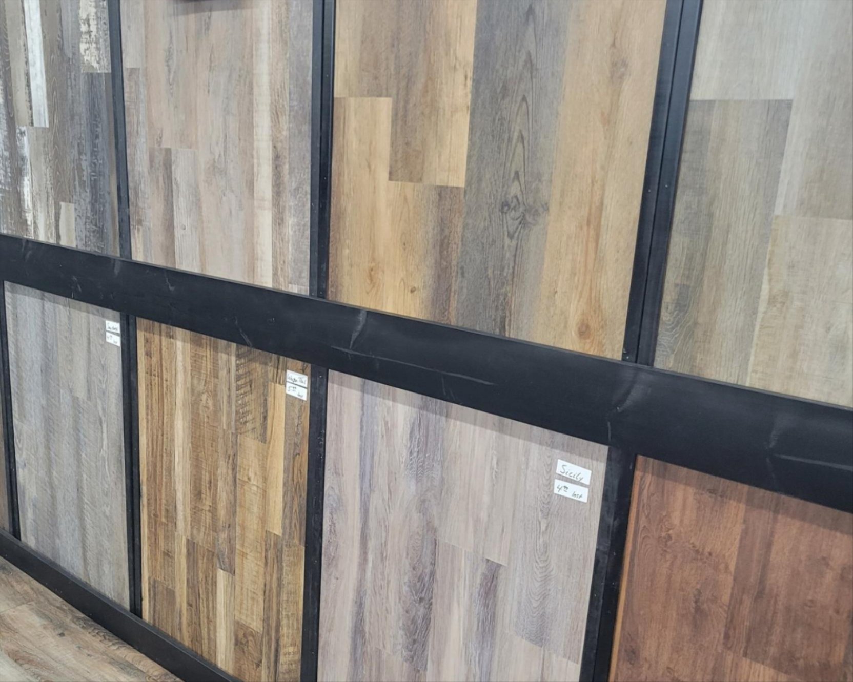 Hardwood and vinyl plank flooring samples at Quality Floors Sallisaw showroom with flexible financing options available Hardwood and vinyl plank flooring samples at Quality Floors Sallisaw showroom with flexible financing options available