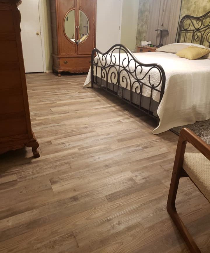 Professional hardwood installation in a bedroom in Sallisaw, OK by Quality Floors