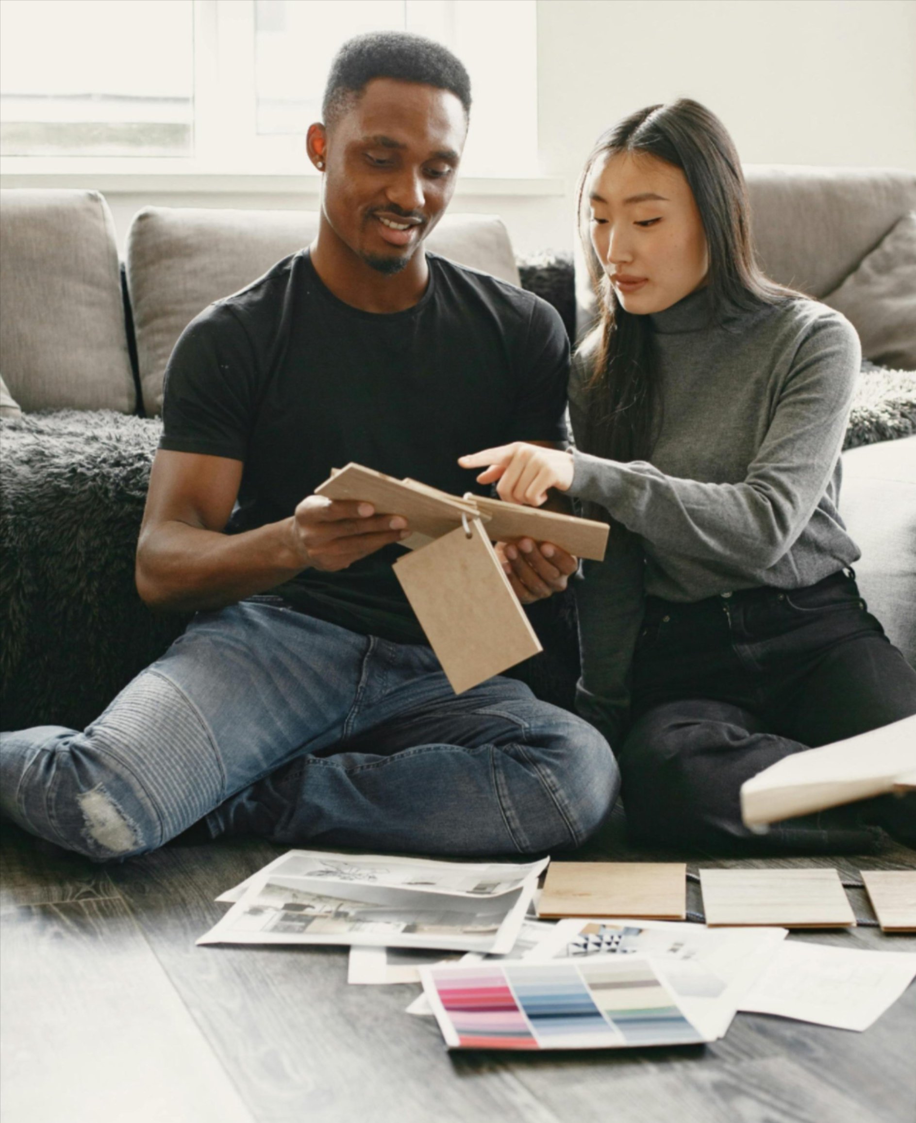 Homeowners reviewing flooring samples with Quality Floors in Sallisaw, OK to choose new flooring options Homeowners reviewing flooring samples with Quality Floors in Sallisaw, OK to choose new flooring options