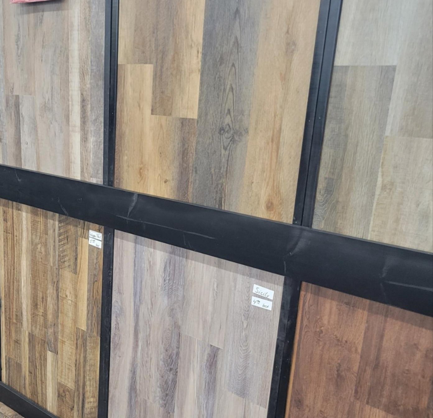 Local flooring professionals installing carpet tiles in Sallisaw, OK – Quality Floors team at work