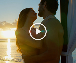 Couple on beach at sunset