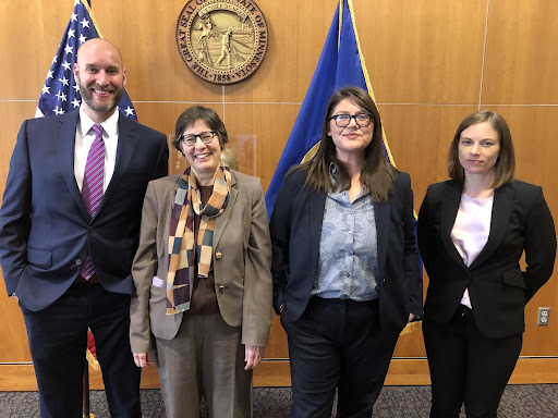 Pictured: (left) MCEA Climate Program Director Ellen Anderson speaks at a press conference prior to the House vote on 100% bill. (right) Rep. Jamie Long takes a selfie with clean energy supporters outside the House chambers (1/26/23)