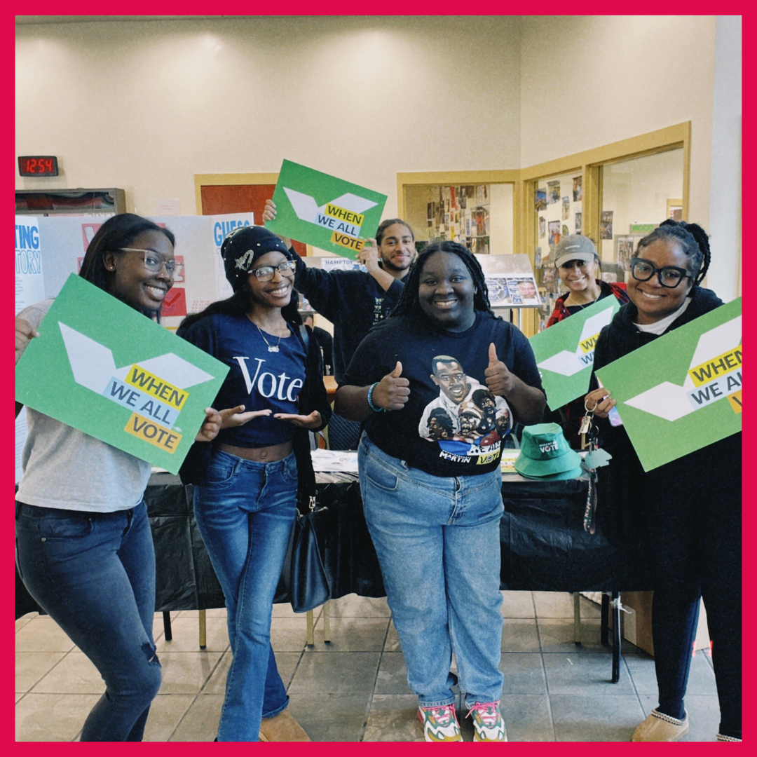 Photo of Shavonne Hines-Foster with volunteers at a voter registration event. 