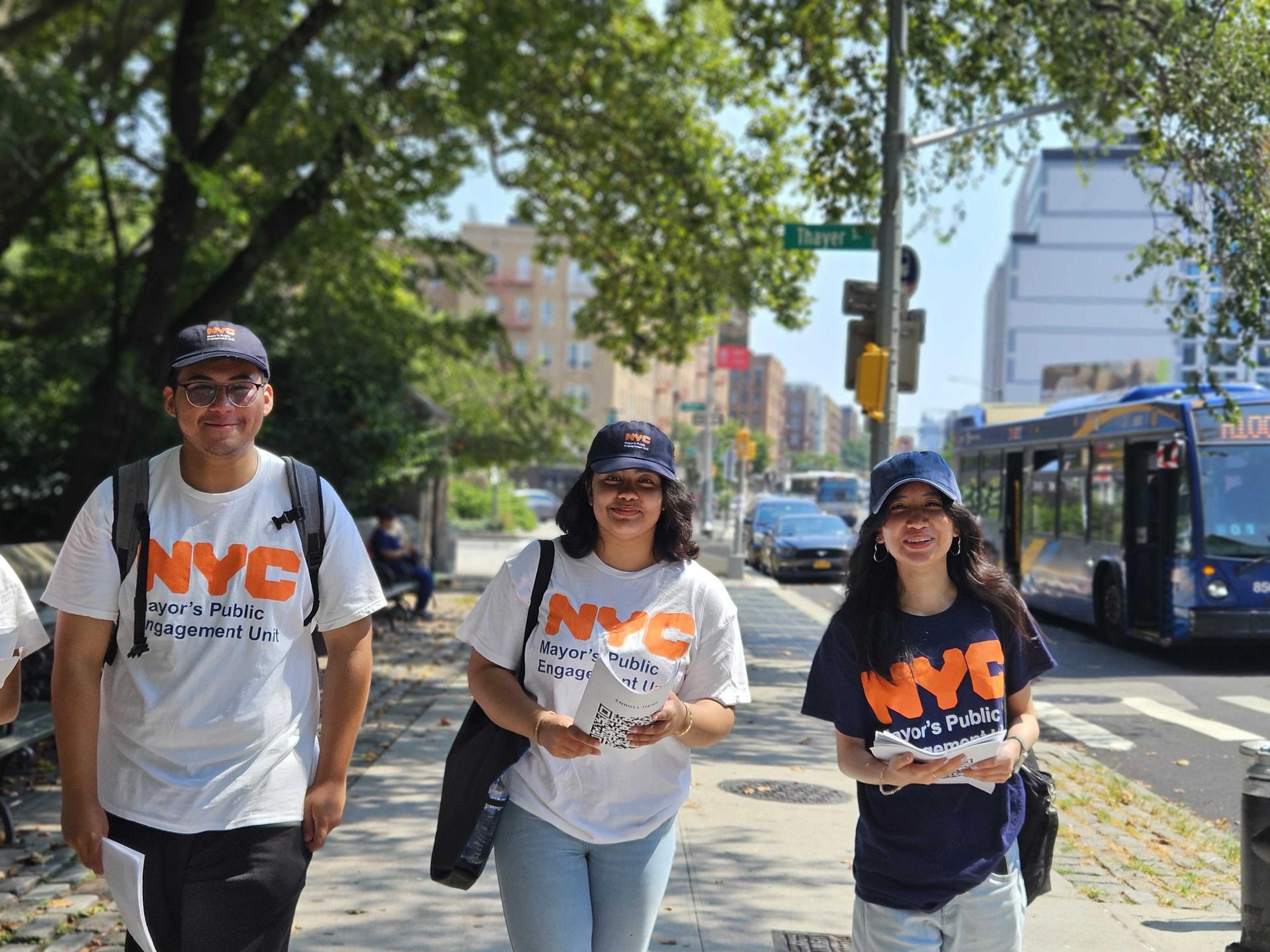 A group of 3 interns canvassing and handing out flyers