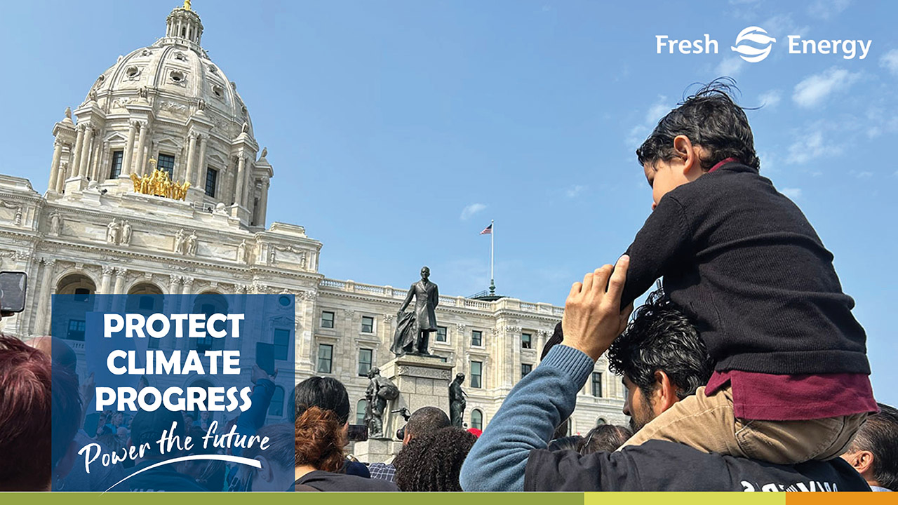 Child on father's shoulders outside Minnesota Capitol, text says ''Protect Climate Progress, Power the future'' with a white Fresh Energy logo