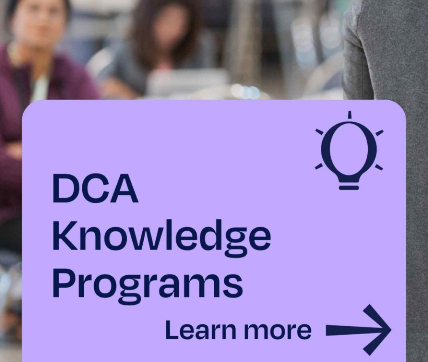 DCA Knowledge Programs over blurred photo of people in learning session.