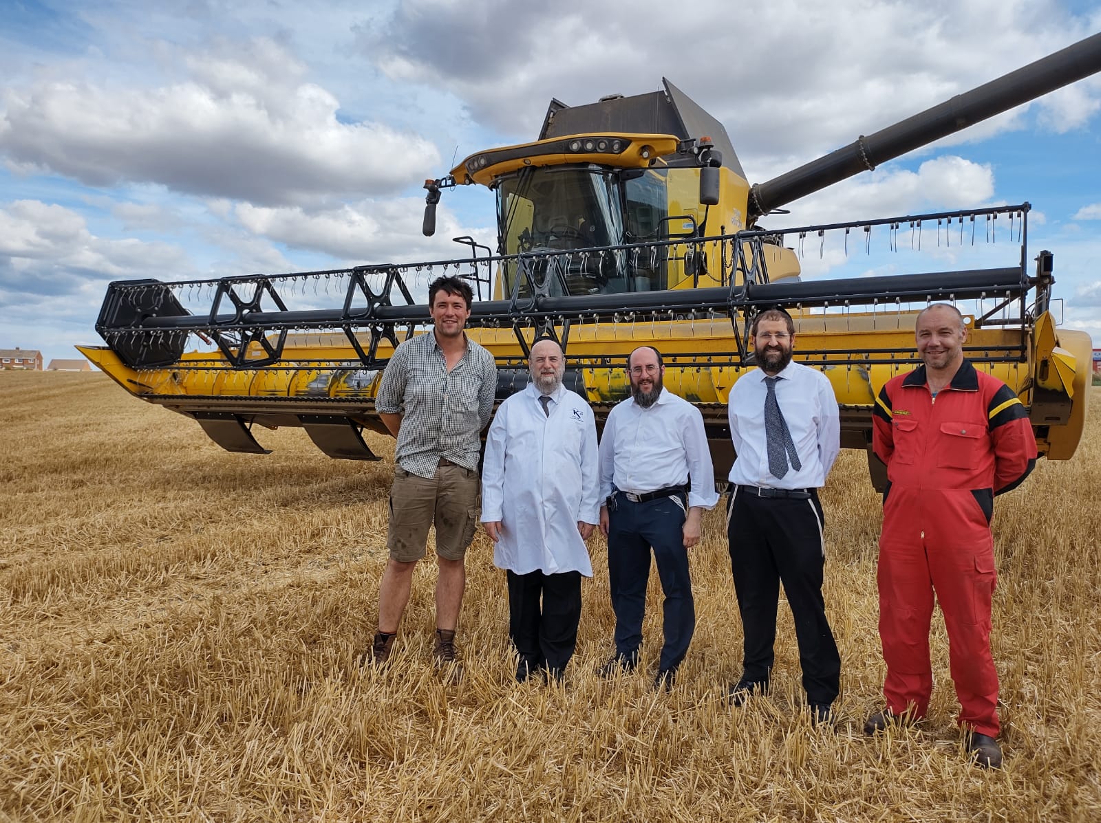 Dayanim supervise cutting of wheat